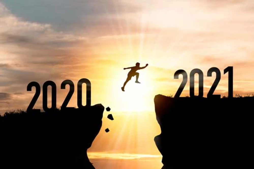 welcome-merry-christmas-happy-new-year-2021-silhouette-man-jumping-from-2020-cliff-2021-cliff-with-cloud-sky-sunlight-resized